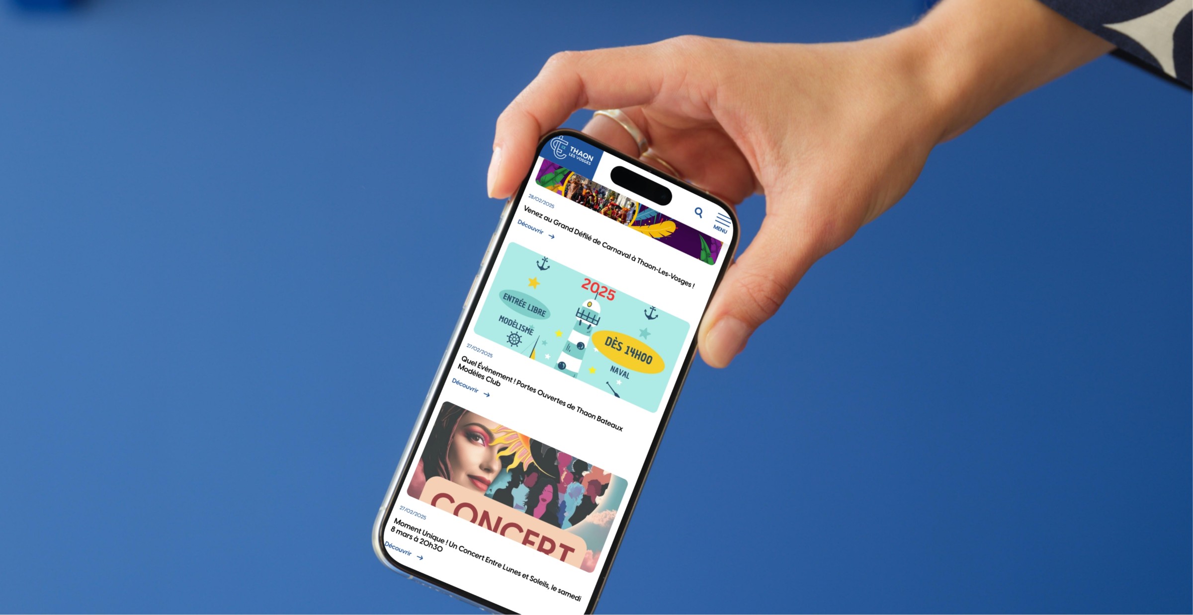 Mockuuups Iphone 15 Pro Mockup In A Womans Hand Against A Blue Background