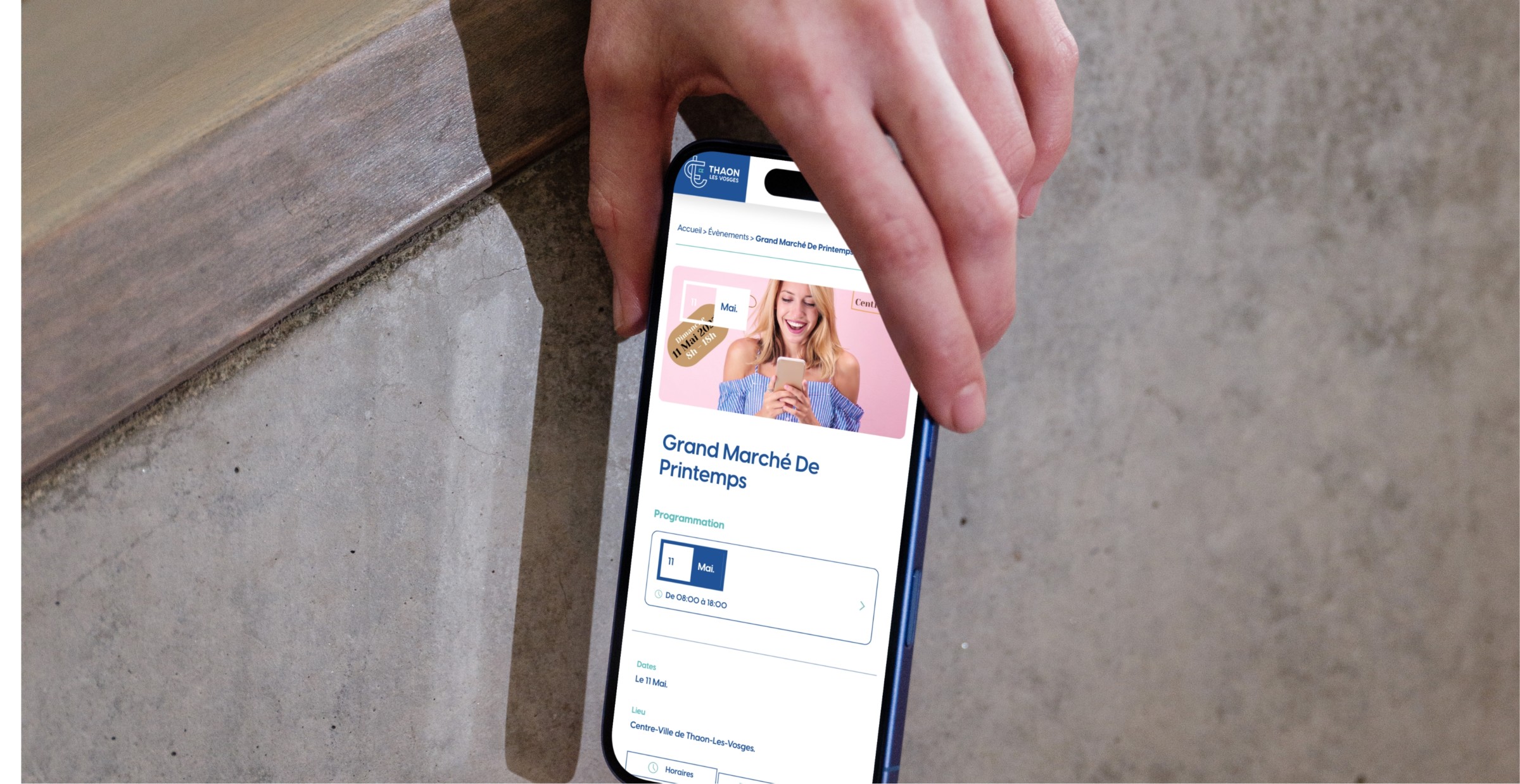 Mockuuups Iphone 16 Mockup Held By Hand Against Concrete