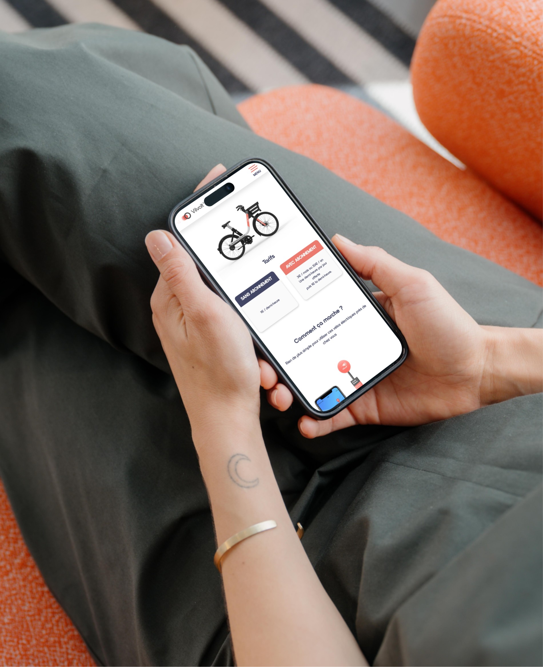 4mockuuups Iphone 15 Pro Mockup In A Womans Hand On A Cozy Couch