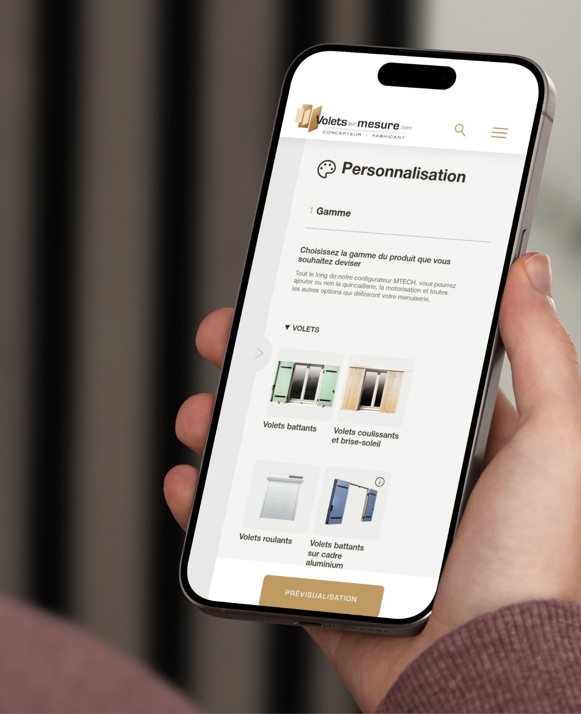 Mockuuups Iphone 15 Pro Mockup In A Mans Hand Against An Indoor Background